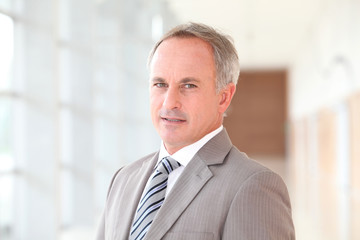 Fototapeta premium Closeup of businessman in grey suit