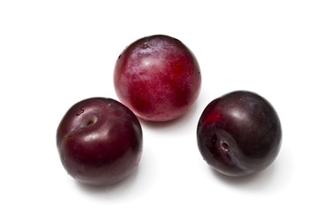 Plums isolated on white