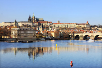 View on the autumn Prague gothic Castle with the Charles Bridge