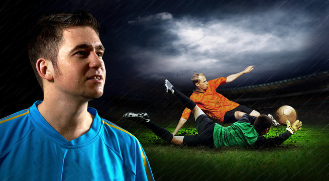 Portrait of Soccer player on the field in night rain
