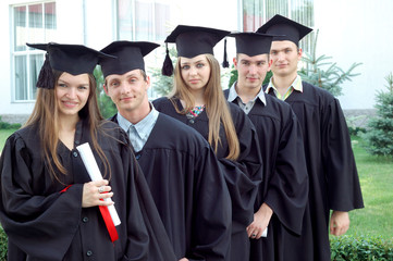Graduates looking into the camera