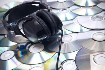 CDs background and headphones