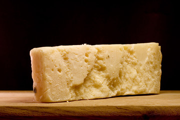 Slice of Parmesan cheese, closeup