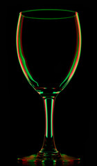 transparent colored empty wine glass on black