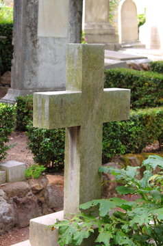Old cross gravestone in an ancient graveyard