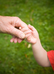 Holding Hands - Love between Child and Grandparent