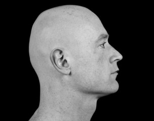 close up picture of a male head from side on black