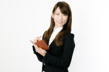 Fototapeta premium メモを取る女性社員