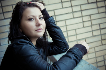 Woman smoking at the balcony