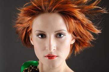Fototapeta premium Beauty portrait of pretty woman with healthy red flying hair, pu