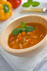 Wooden bowl with mexican bean soup