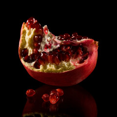 scattered pomegranate seeds and fragments isolated