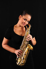 Fototapeta na wymiar Young woman with saxophone