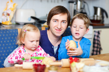 Father with two kids at kitchen