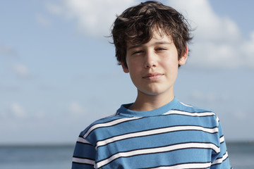 Young boy squinting © Felix Mizioznikov