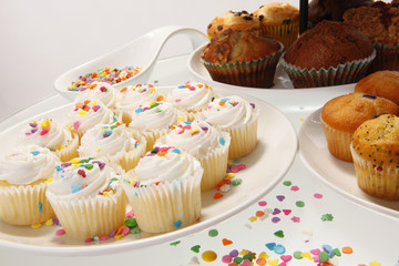 Snow white sprinkled fresh cupcakes