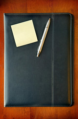 Executive Folder with note and pen