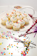 Snow white sprinkled fresh cupcakes