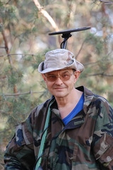 Fototapeta premium Man with metal detector in the forest