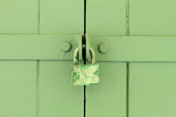 Rusty Lock on a wrought-wood Door