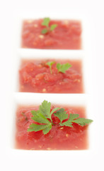 Ground tomatoes served with fresh parsley