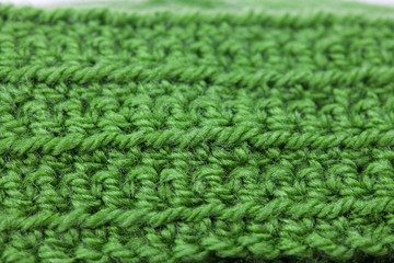 Skein of wool and knitted piece  background