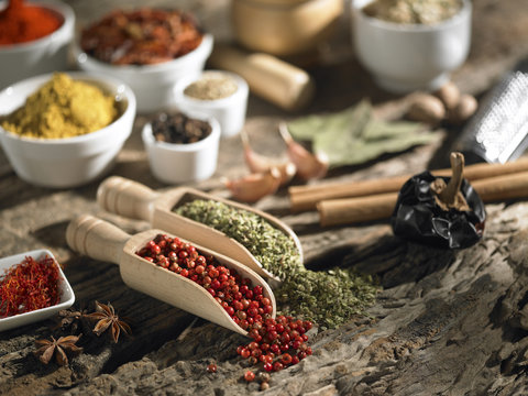 Various spices on a background of old wood with selective focus