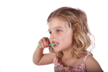 Side-on of young girl brushing her teeth