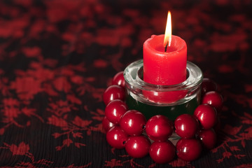 birning candle with red beads