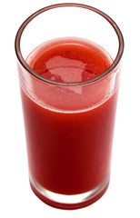Tomato juice in clear glass isolated on white background