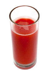 Tomato juice in clear glass isolated on white background