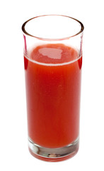 Tomato juice in clear glass isolated on white background