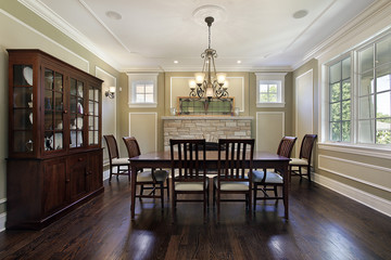 Dining room with stone fireplace