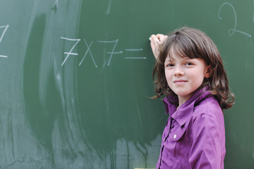 happy school girl on math classes