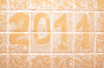 word "2011" made of foam on wall
