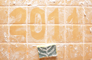 word "2011" made of foam on wall