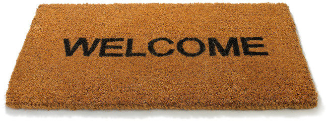 Welcome front door mat on a white background - obrazy, fototapety, plakaty