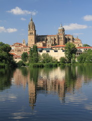 Fototapeta premium Old cathedral reflected in water of Tormes river, Salamanca