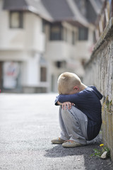 sad lonely boy on street