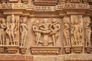Fototapeta na wymiar Erotic sculptures 0n Hindu Temple at Khajuraho, India.