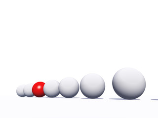 Conceptual crowd of spheres with one red glass sphere