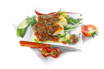 cheese cannelloni on square white