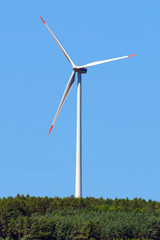 modern windmill in forest