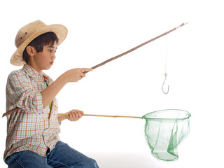 boy with fishing pole and net