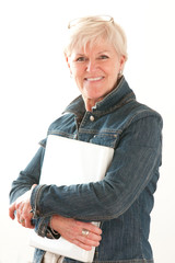 Attractive woman in her fifties with laptop