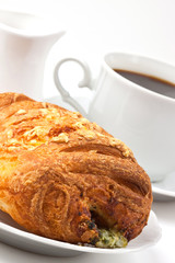 Breakfast: coffee and bun with cheese and spinach