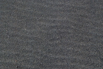 Lavasand grau Lava Hintergrund Wellen Sand Fuerteventura