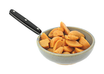 Cut canned yams in bowl