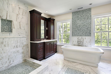 Master bath with large white tub