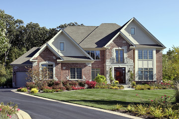 Brick home with front balcony